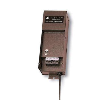 Three-quarter view of Kichler 15M300AZT 300W manual landscape transformer in textured architectural bronze, showing steel housing and mounting features, weather-resistant construction, and wire lead.