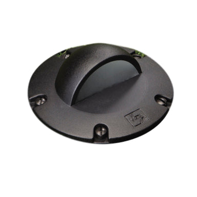 Vista GW-5263 in-ground well light aluminum housing in black with tempered glass lens, shown installed recessed in ground (angled view).