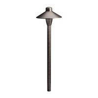 Kichler 15478CBR 12V path light in Centennial Brass, showing cast brass body, glass-lens dome, and in-ground stake.