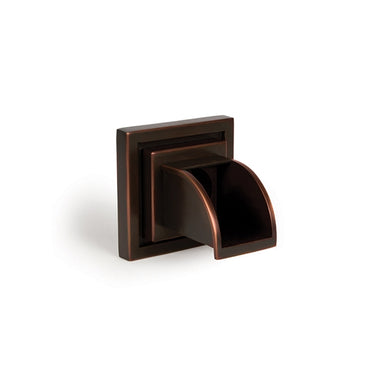 Mantova WSM-S solid brass wall spout in oil-rubbed bronze finish mounted on a wall; square spout with integrated drip edge.