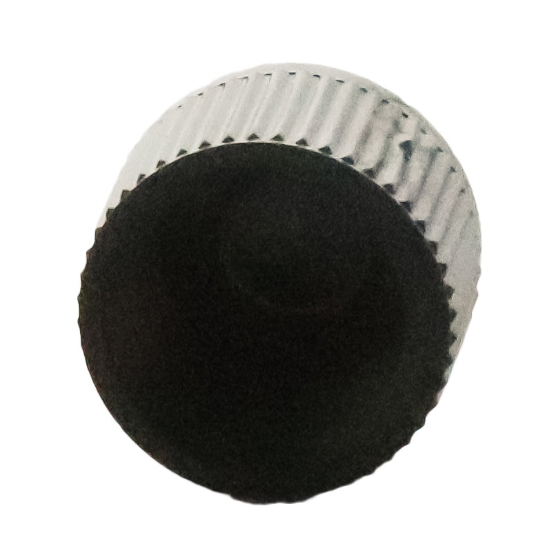 Close-up of Rain Bird XBT10 showing outlet barb and emitter profile; durable UV-resistant plastic construction is visible.