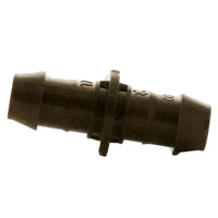 Detailed close-up of the barbed profile and insertion end of the XFFCOUP 17mm coupling, showing the secure grip and molded tube-stop feature.