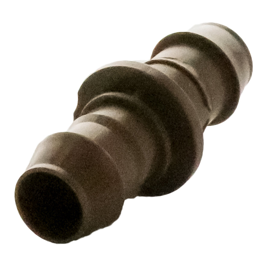 Group view of Rain Bird XFFCOUP 17mm barb couplings stacked to show color, finish and consistent molded quality for landscape drip installations.