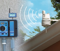 Close-up of CL-100 transmitter showing solar sensor, rain inlet and mounting bracket for outdoor installation.