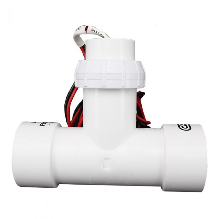 CST FSI-T15-001 wired flow sensor mounted in a 1-1/2 inch PVC tee, showing impeller housing, molded tee and threaded retaining nut.