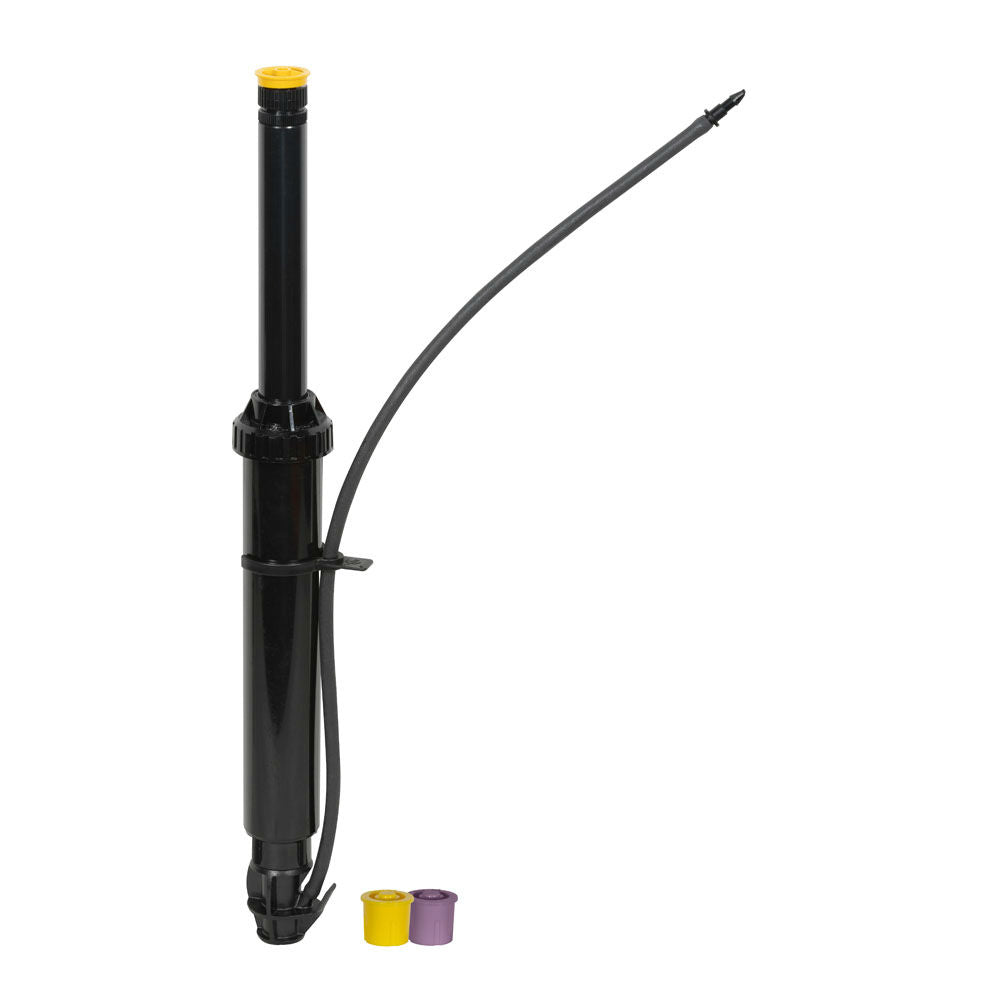 Rain Bird OPERIND pop-up drip system operation indicator with extended 6-inch stem and yellow indicator cap above subsurface dripline, UV-resistant plastic construction
