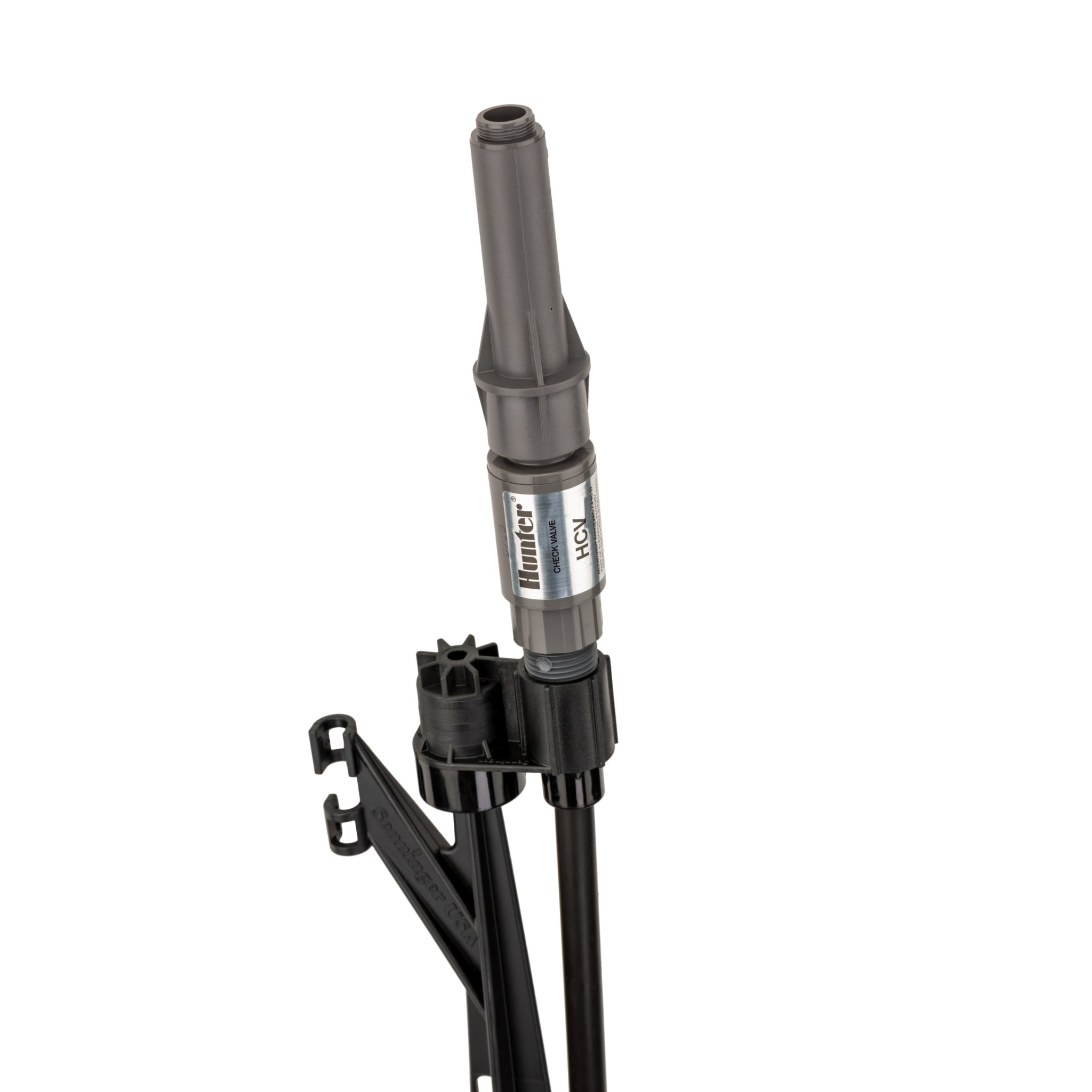 Detail of the Hunter HCV check valve and pressure-regulated shrub adapter on the MP stake assembly, showing durable plastic components and connection points.