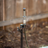 Full-length view of the MP Stake Kit upright position in landscape application, highlighting the 26-inch stake, tubing run and adapter ready for MP Rotator nozzle installation.