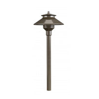Bronze FX PL path light on 12-inch riser with die-cast aluminum body, lens, and ground spike.